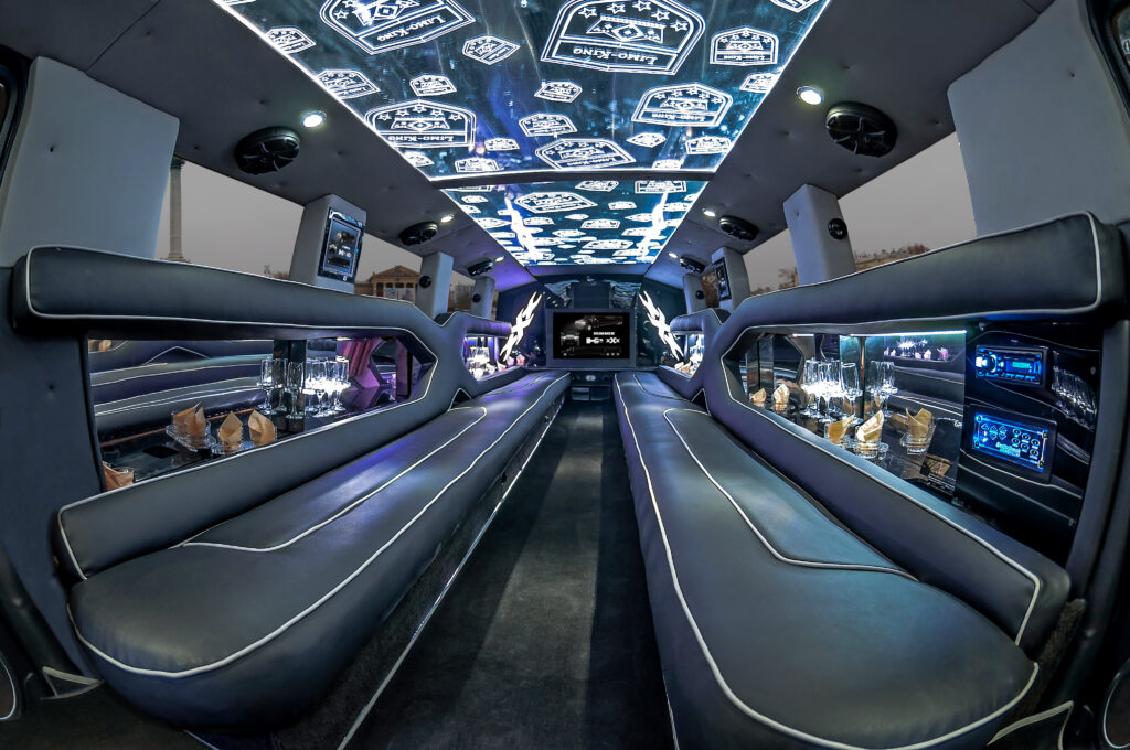 Hummer Limousine Budapest interior featuring luxurious leather seating, LED lighting, and a minibar for an unforgettable experience.
