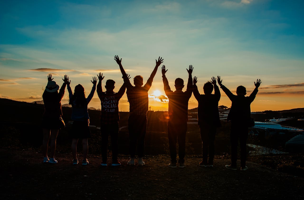 A group of friends celebrating at sunset, symbolizing the unforgettable group experiences in Budapest.