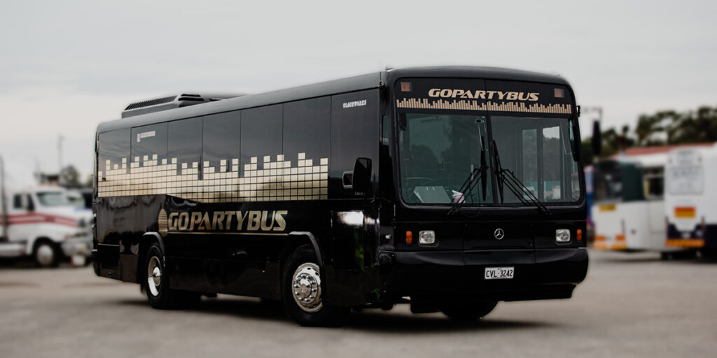 Black party bus in Budapest with neon lights and nightclub-style design, ideal for energetic group celebrations.