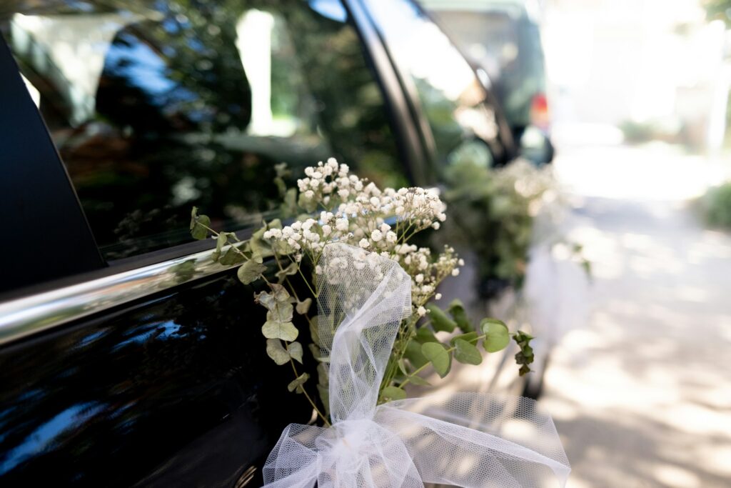 Wedding Hummer limousine decorated with flowers and ribbons in Budapest, offering elegance and perfect photo opportunities.