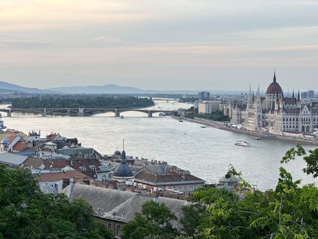 Panoramic view of Budapest Parliament and Margaret Island along the Danube at sunset