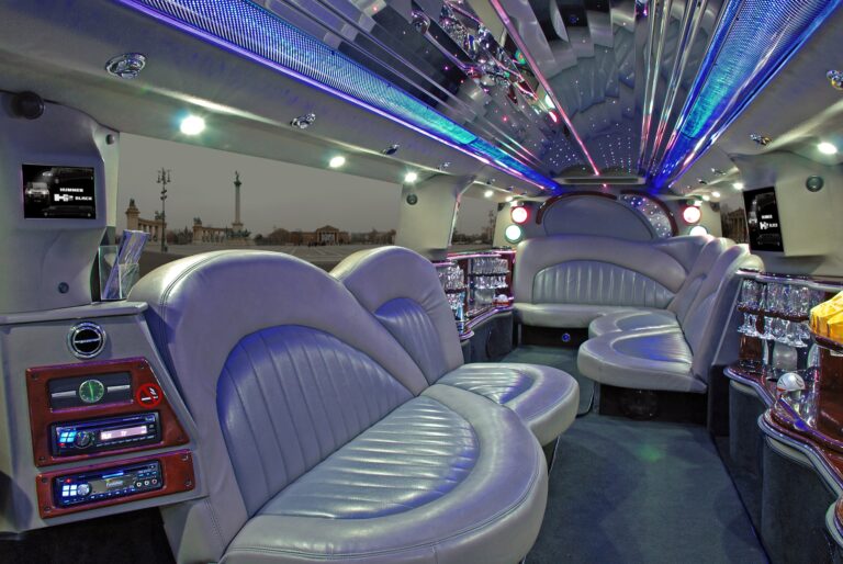 Luxury interior of a Hummer limo in Budapest with leather seats, LED lights and party-ready atmosphere.