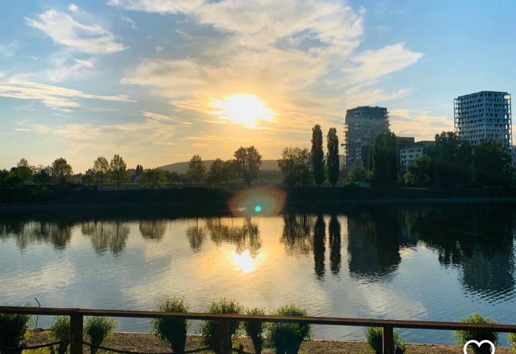 Sunset view at Kopaszi Dam in Budapest, a modern riverside spot for luxury limo tours