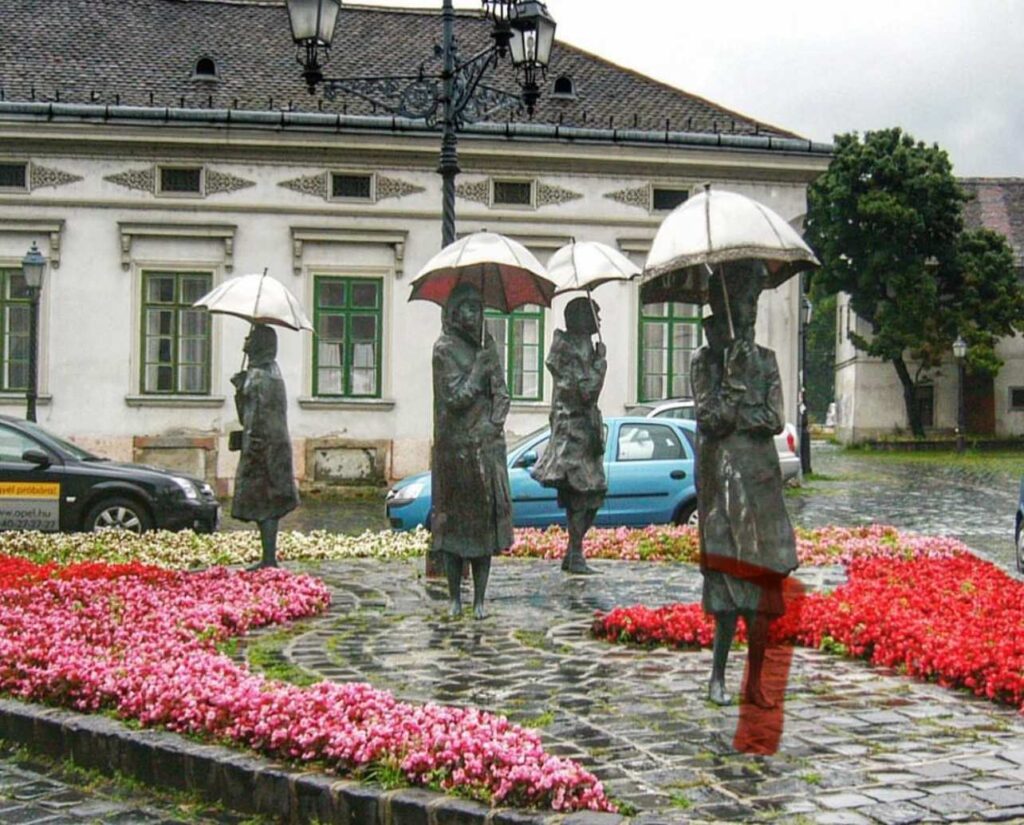 Óbuda riverside square with umbrella statues, a vintage Budapest photo spot with historic charm