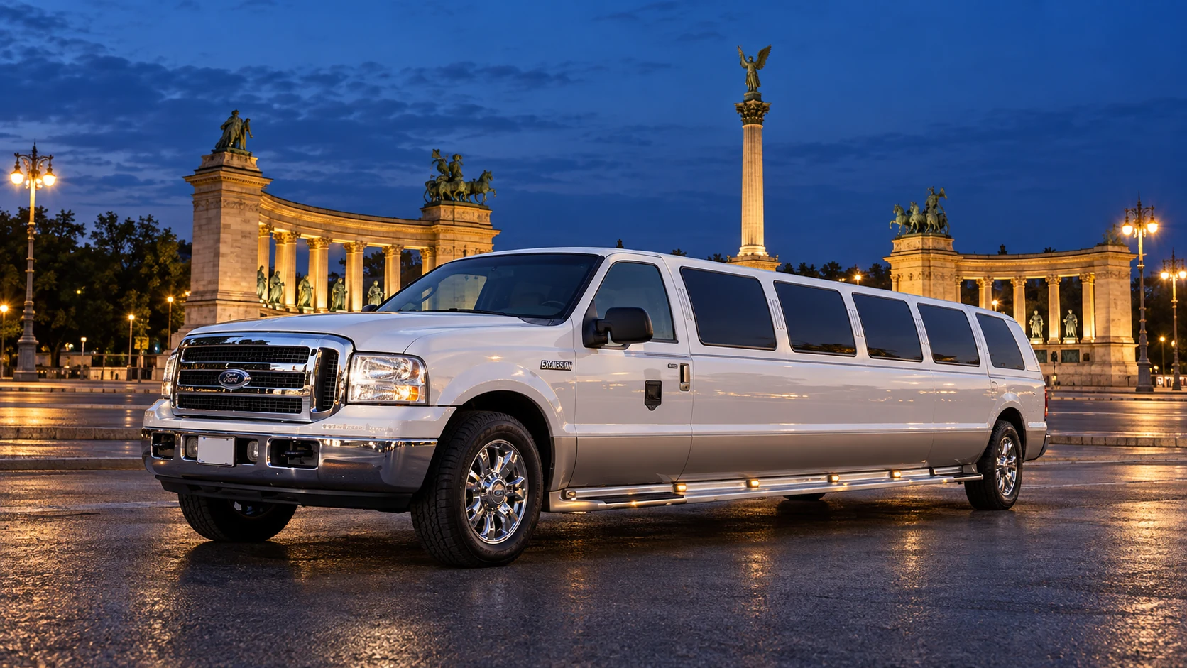 White Ford Excursion stretch limousine beside the illuminated monuments of Heroes’ Square in Budapest.